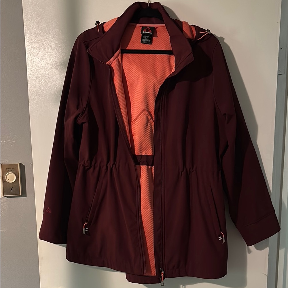 Burgundy and orange Gerry rain jacket.